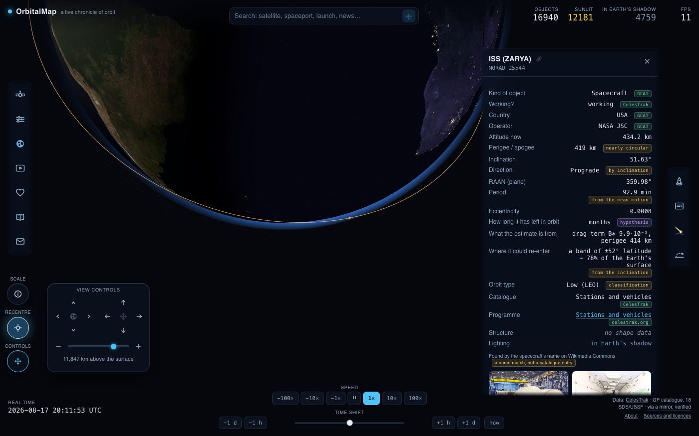 A satellite card beside the globe, with the camera locked to the object